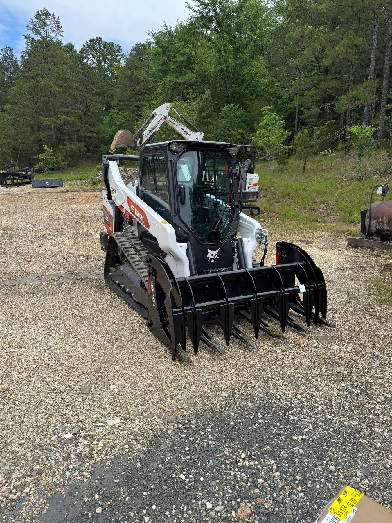 Bobcat T76 Compact Track Loader with grapple attachment